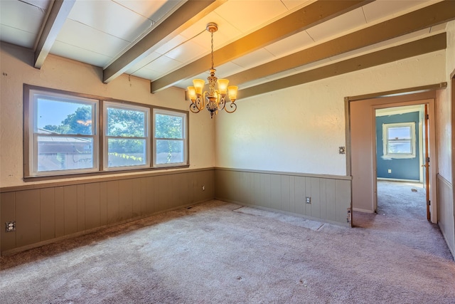 12 Rivera Ln, West Sayville, NY 11796 - empty room with a chandelier, beam ceiling, a wainscoted wall, wooden walls, and carpet floors