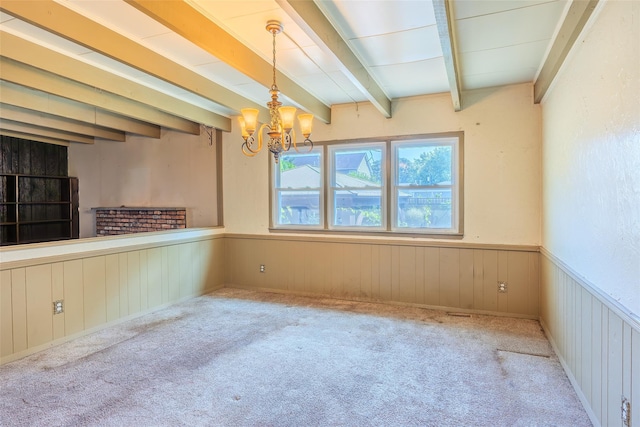 12 Rivera Ln, West Sayville, NY 11796 - unfurnished room featuring a chandelier, beam ceiling, wainscoting, carpet flooring, and wooden walls
