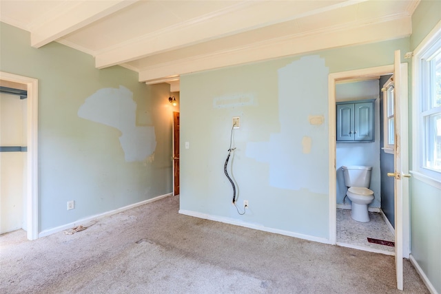 12 Rivera Ln, West Sayville, NY 11796 - unfurnished bedroom featuring carpet floors, beam ceiling, and ensuite bathroom