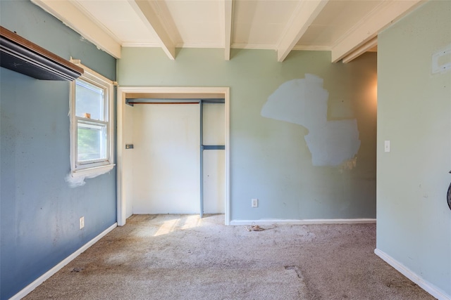 12 Rivera Ln, West Sayville, NY 11796 - unfurnished bedroom featuring beamed ceiling, carpet flooring, and a closet