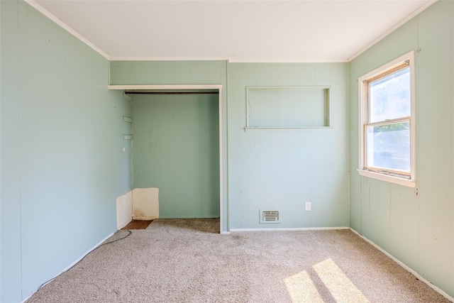 12 Rivera Ln, West Sayville, NY 11796 - unfurnished bedroom featuring crown molding, carpet, and a closet