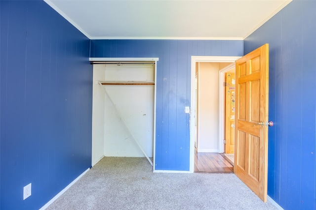 12 Rivera Ln, West Sayville, NY 11796 - unfurnished bedroom featuring carpet flooring, a closet, and ornamental molding