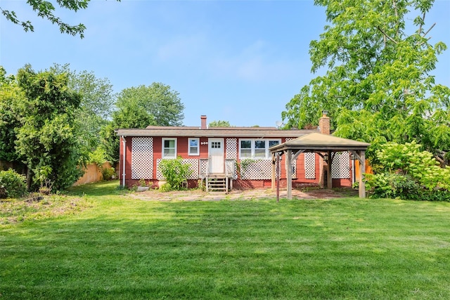 12 Rivera Ln, West Sayville, NY 11796 - back of property featuring a gazebo and a chimney
