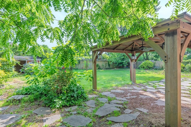 12 Rivera Ln, West Sayville, NY 11796 - fenced backyard featuring a gazebo and ceiling fan