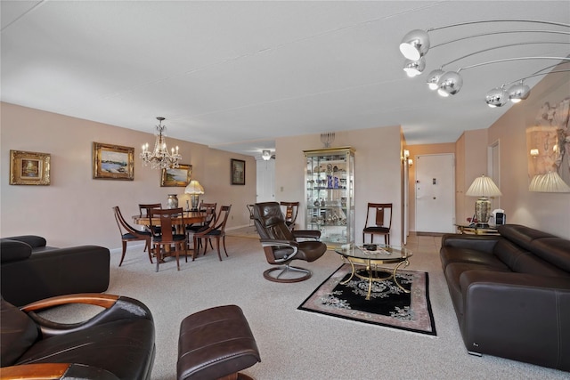 100 High Point Dr Unit 310, Hartsdale, NY 10530 - carpeted living room featuring a chandelier and baseboards