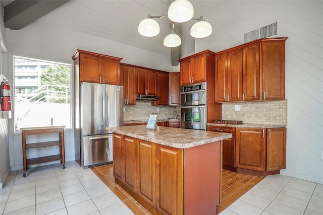 100 High Point Dr Unit 310, Hartsdale, NY 10530 - kitchen with stainless steel appliances, light tile patterned floors, under cabinet range hood, backsplash, and light countertops