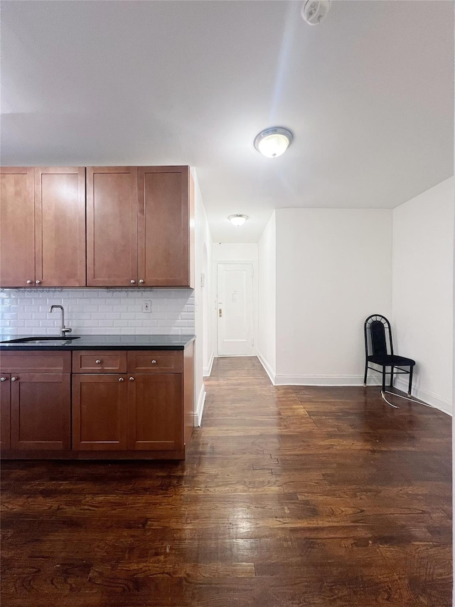 14809 Northern Blvd Unit 3N, Flushing, NY 11354 - kitchen featuring dark countertops, tasteful backsplash, and dark wood-type flooring
