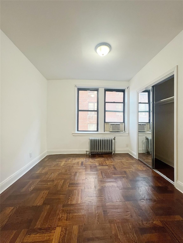 14809 Northern Blvd Unit 3N, Flushing, NY 11354 - unfurnished bedroom featuring radiator heating unit, a closet, and cooling unit