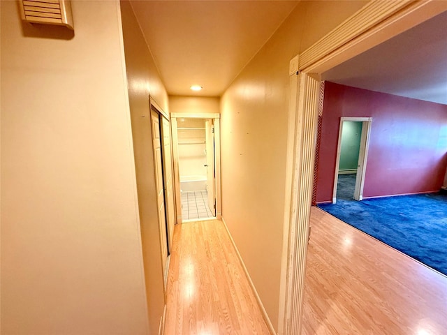 18 Ivy St Unit 1B, Farmingdale, NY 11735 - corridor with wood finished floors, recessed lighting, and baseboard heating