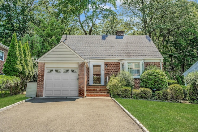 86 Briary Rd, Dobbs Ferry, NY 10522 - view of front facade featuring brick siding, a garage, asphalt driveway, a shingled roof, and a chimney