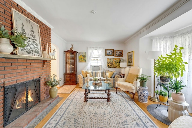 86 Briary Rd, Dobbs Ferry, NY 10522 - living room with wood finished floors, ornamental molding, and a brick fireplace