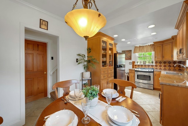 86 Briary Rd, Dobbs Ferry, NY 10522 - dining area with light tile patterned flooring, ornamental molding, and recessed lighting