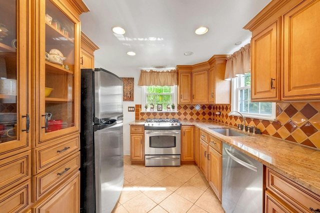 86 Briary Rd, Dobbs Ferry, NY 10522 - kitchen featuring appliances with stainless steel finishes, healthy amount of natural light, light tile patterned flooring, backsplash, and recessed lighting