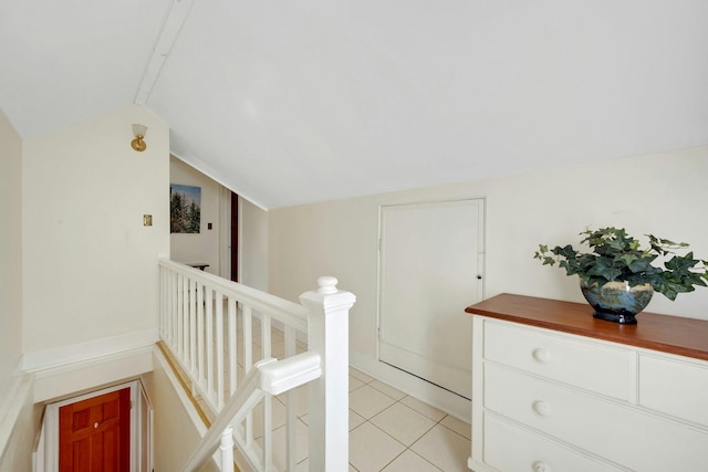 86 Briary Rd, Dobbs Ferry, NY 10522 - hall with an upstairs landing, lofted ceiling, and light tile patterned floors