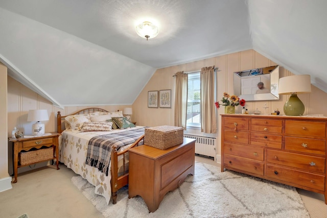 86 Briary Rd, Dobbs Ferry, NY 10522 - bedroom with radiator, lofted ceiling, and light colored carpet