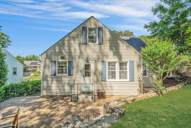 86 Briary Rd, Dobbs Ferry, NY 10522 - rear view of property featuring a yard and a patio area
