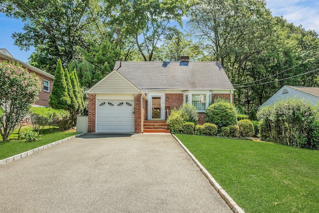 86 Briary Rd, Dobbs Ferry, NY 10522 - view of front of home featuring brick siding, a garage, asphalt driveway, a front yard, and a chimney