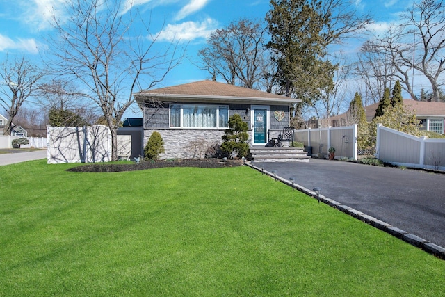 117 E Madison St, East Islip, NY 11730 - bungalow-style home featuring stone siding and asphalt driveway