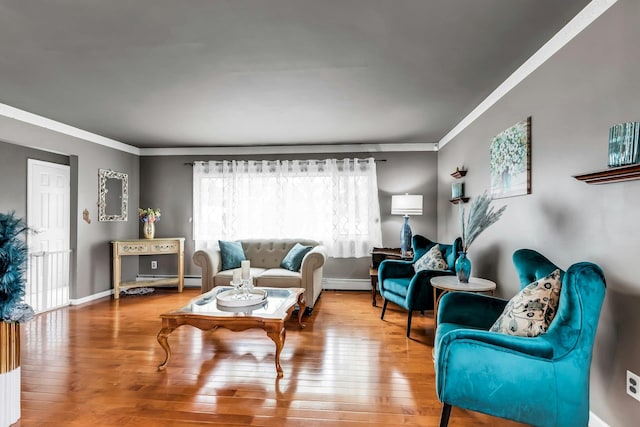 117 E Madison St, East Islip, NY 11730 - living area with crown molding, wood-type flooring, and a baseboard radiator