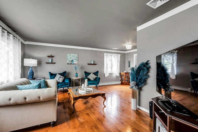 117 E Madison St, East Islip, NY 11730 - living room with ornamental molding, hardwood / wood-style flooring, and baseboard heating