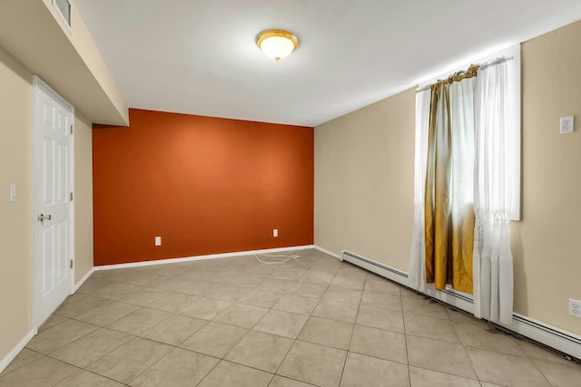 117 E Madison St, East Islip, NY 11730 - unfurnished room featuring a baseboard heating unit and light tile patterned flooring
