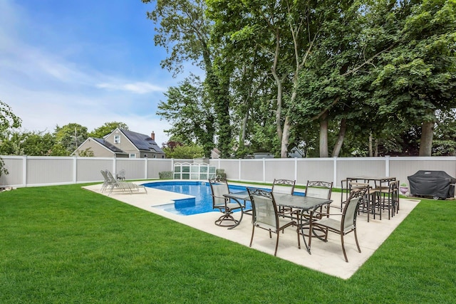 117 E Madison St, East Islip, NY 11730 - view of swimming pool with area for grilling, a fenced backyard, and a patio area