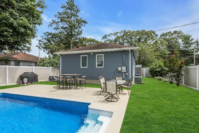 117 E Madison St, East Islip, NY 11730 - rear view of house featuring a fenced backyard, a patio, and a chimney