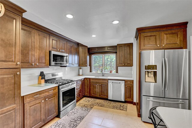 18 Pashen Pl, Dix Hills, NY 11746 - kitchen featuring stainless steel appliances, recessed lighting, light countertops, light tile patterned floors, and brown cabinetry