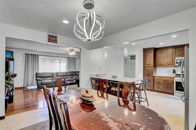 18 Pashen Pl, Dix Hills, NY 11746 - dining area with recessed lighting, light tile patterned flooring, a chandelier, and a ceiling fan