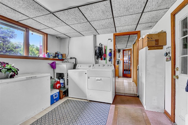18 Pashen Pl, Dix Hills, NY 11746 - washroom featuring washer and clothes dryer and light tile patterned floors