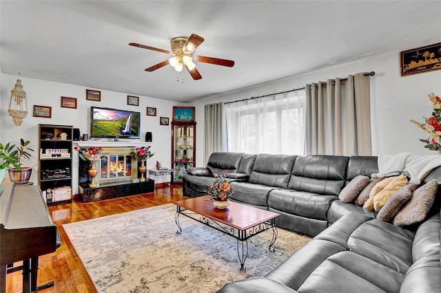 18 Pashen Pl, Dix Hills, NY 11746 - living area with a ceiling fan, wood finished floors, and a glass covered fireplace