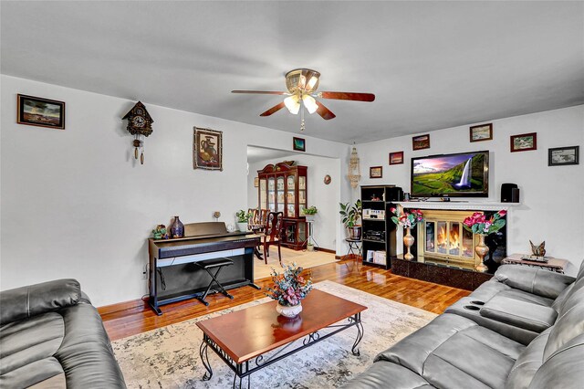 18 Pashen Pl, Dix Hills, NY 11746 - living area with a ceiling fan, wood finished floors, and a glass covered fireplace