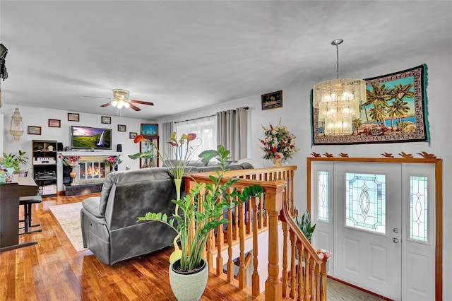18 Pashen Pl, Dix Hills, NY 11746 - living area featuring a chandelier, wood finished floors, and a ceiling fan