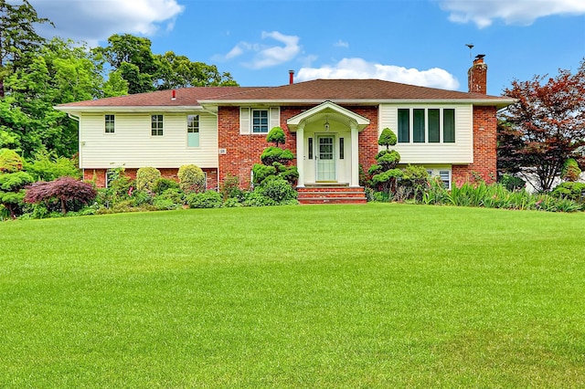 18 Pashen Pl, Dix Hills, NY 11746 - bi-level home with a chimney, brick siding, and a front yard