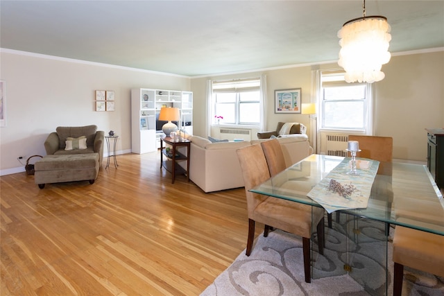 162-41 Powells Cove Blvd Unit 4K, Beechhurst, NY 11357 - dining room with radiator heating unit, a chandelier, light wood finished floors, and ornamental molding