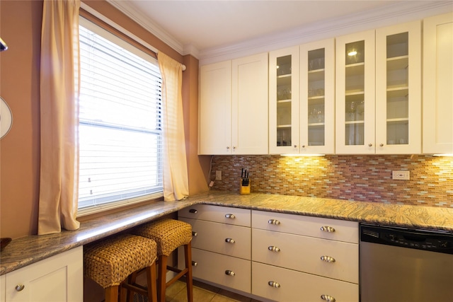 162-41 Powells Cove Blvd Unit 4K, Beechhurst, NY 11357 - kitchen with stainless steel dishwasher, glass insert cabinets, white cabinets, healthy amount of natural light, and crown molding