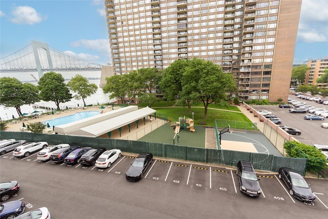 162-41 Powells Cove Blvd Unit 4K, Beechhurst, NY 11357 - view of building exterior featuring uncovered parking