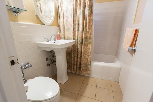 162-41 Powells Cove Blvd Unit 4K, Beechhurst, NY 11357 - bathroom featuring tile walls, tile patterned flooring, shower / bath combo, and a wainscoted wall