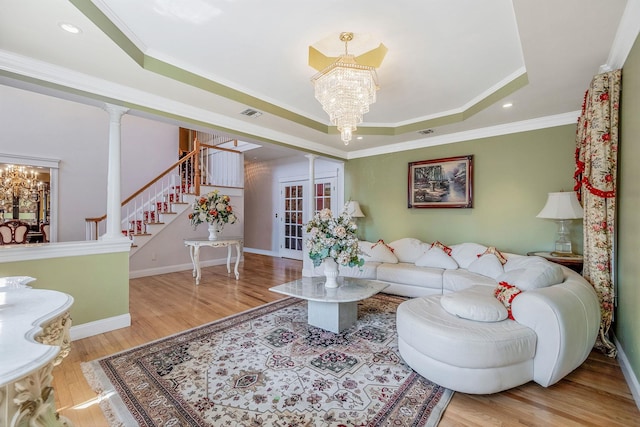 3 Kohlsaat Ct, Smithtown, NY 11787 - living area with a chandelier, a tray ceiling, wood finished floors, recessed lighting, and crown molding