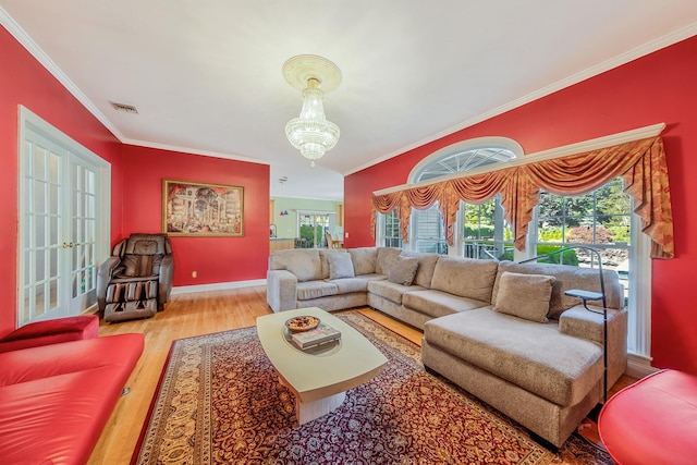 3 Kohlsaat Ct, Smithtown, NY 11787 - living area featuring ornamental molding, wood finished floors, and a chandelier