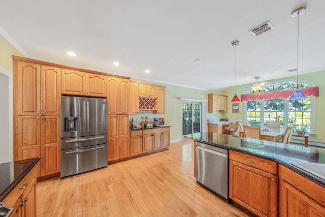 3 Kohlsaat Ct, Smithtown, NY 11787 - kitchen featuring appliances with stainless steel finishes, light wood finished floors, hanging light fixtures, ornamental molding, and recessed lighting