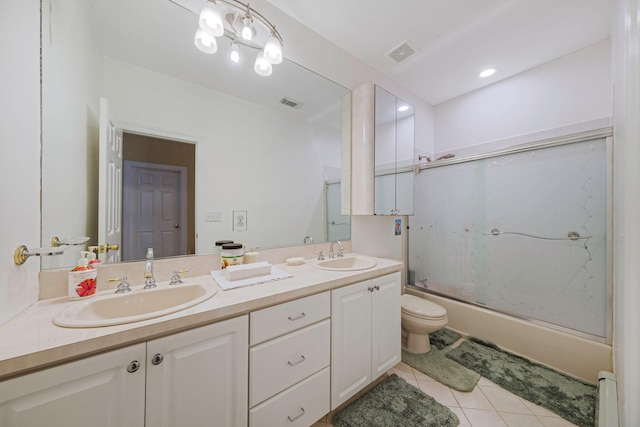 3 Kohlsaat Ct, Smithtown, NY 11787 - full bathroom featuring double vanity, bath / shower combo with glass door, tile patterned flooring, and a baseboard heating unit