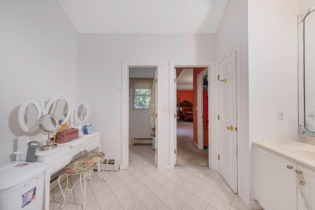 3 Kohlsaat Ct, Smithtown, NY 11787 - bathroom featuring baseboard heating, vanity, and tile patterned floors