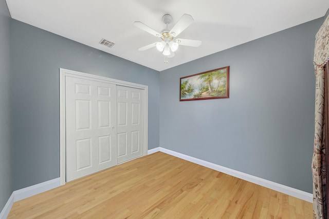 3 Kohlsaat Ct, Smithtown, NY 11787 - unfurnished bedroom with wood finished floors, a closet, and ceiling fan
