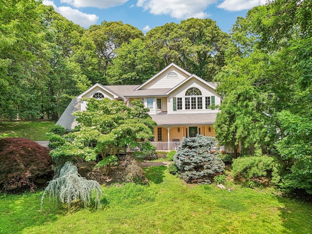 10 Bryan Meadow Path, Northport, NY 11768 - view of front of house featuring a porch and a front lawn