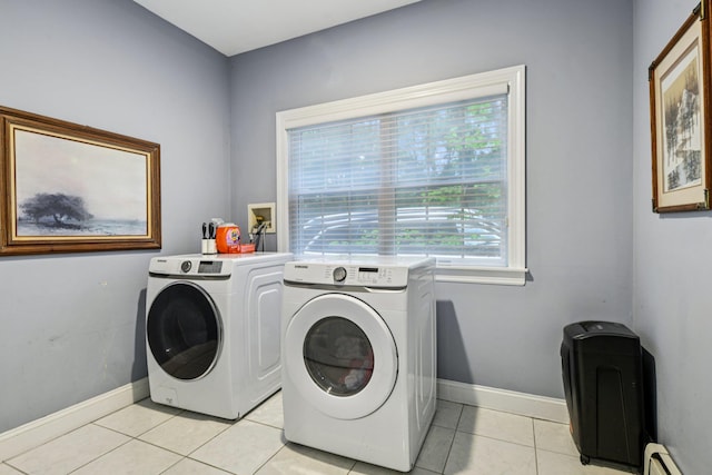 10 Bryan Meadow Path, Northport, NY 11768 - laundry room with washing machine and clothes dryer, a baseboard heating unit, and light tile patterned floors