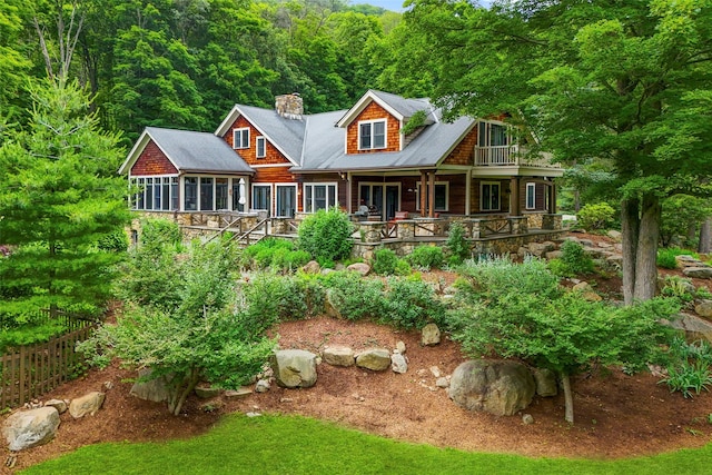 17 Half Moon Rdg, Cold Spring, NY 10516 - rear view of house featuring a chimney, a porch, and a forest view
