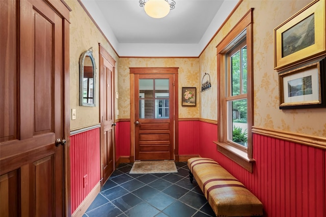 17 Half Moon Rdg, Cold Spring, NY 10516 - doorway to outside featuring wainscoting, plenty of natural light, dark tile patterned floors, and wallpapered walls