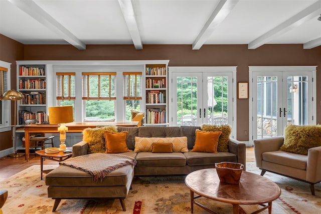 17 Half Moon Rdg, Cold Spring, NY 10516 - living area featuring french doors, plenty of natural light, beam ceiling, a desk, and light wood-style floors