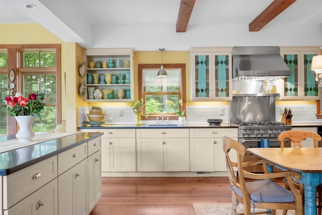 17 Half Moon Rdg, Cold Spring, NY 10516 - kitchen featuring wall chimney range hood, beamed ceiling, healthy amount of natural light, dark countertops, and tasteful backsplash